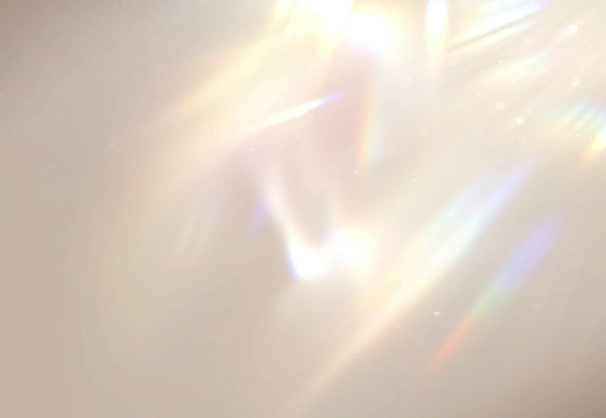 Abstract image of sun rays reflecting on skin cells.